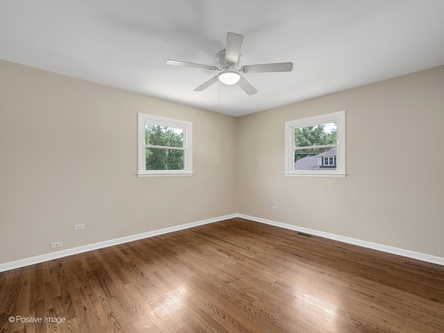 5895 Virginia Ave, Clarendon Hills, IL 60514 - empty room featuring healthy amount of natural light, wood finished floors, and ceiling fan
