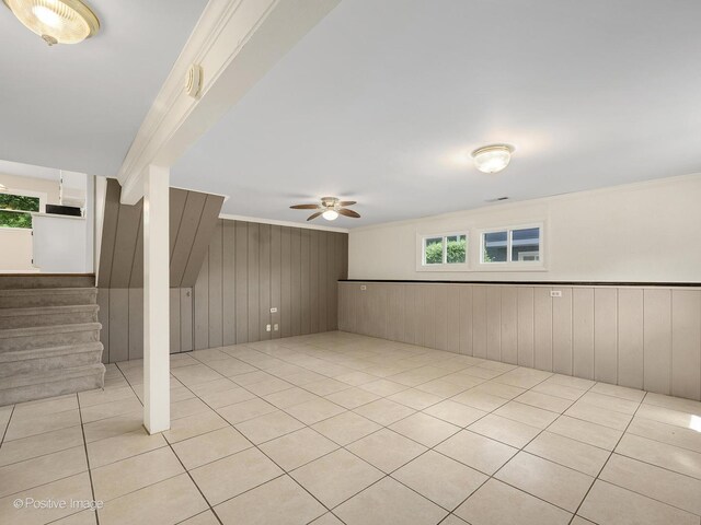 5895 Virginia Ave, Clarendon Hills, IL 60514 - empty room featuring plenty of natural light, wooden walls, ceiling fan, stairway, and light tile patterned floors