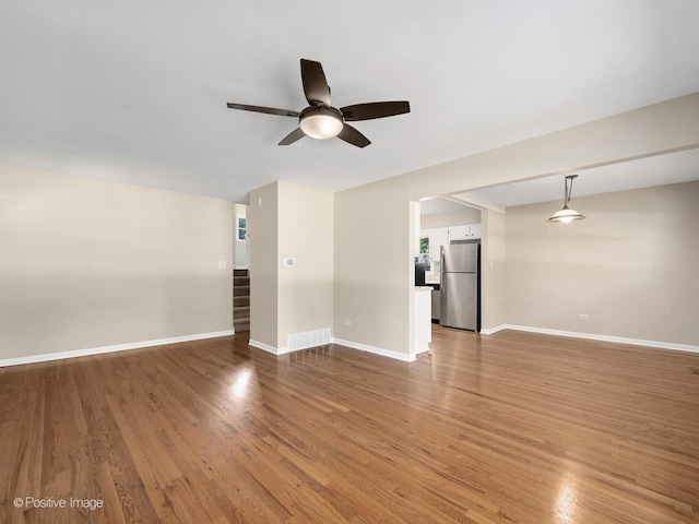 5895 Virginia Ave, Clarendon Hills, IL 60514 - unfurnished living room with a ceiling fan, light wood-style flooring, and stairway