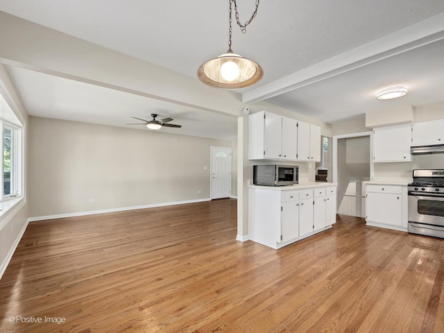 5895 Virginia Ave, Clarendon Hills, IL 60514 - kitchen featuring appliances with stainless steel finishes, beam ceiling, light countertops, light wood finished floors, and open floor plan