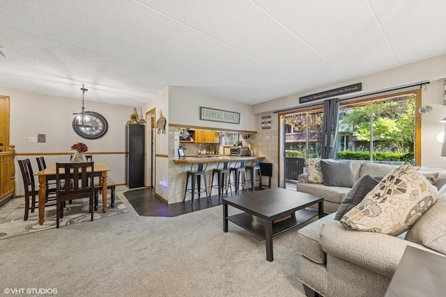 5204 Midlothian Unit 214, Crestwood, IL 60418 - living room featuring carpet and a chandelier