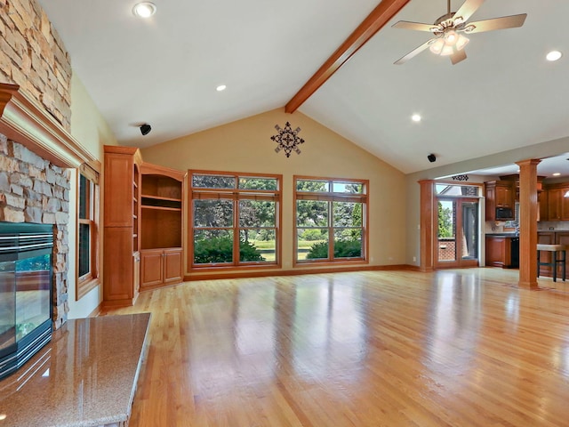 9804 Palmer Dr, Lakewood, IL 60014 - unfurnished living room with a fireplace, decorative columns, light wood-type flooring, beamed ceiling, and ceiling fan