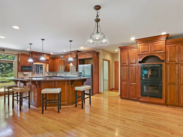 9804 Palmer Dr, Lakewood, IL 60014 - kitchen with black appliances, recessed lighting, light wood-style floors, backsplash, and brown cabinets