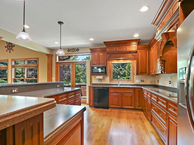 9804 Palmer Dr, Lakewood, IL 60014 - kitchen with black appliances, light wood-type flooring, backsplash, hanging light fixtures, and recessed lighting