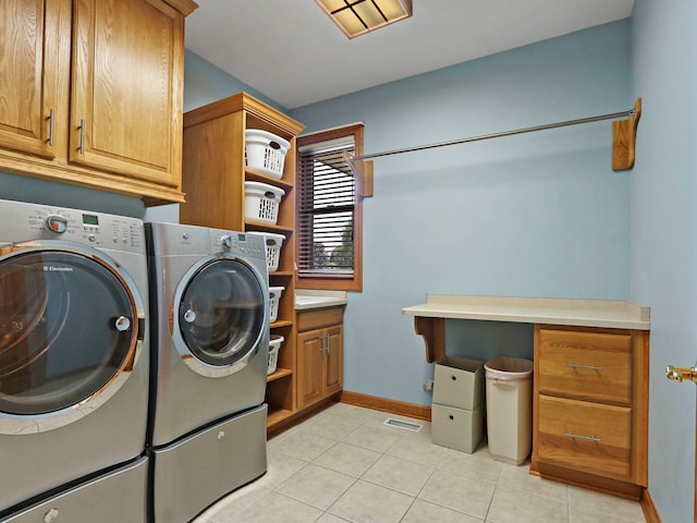 9804 Palmer Dr, Lakewood, IL 60014 - laundry room with cabinet space, separate washer and dryer, and light tile patterned floors
