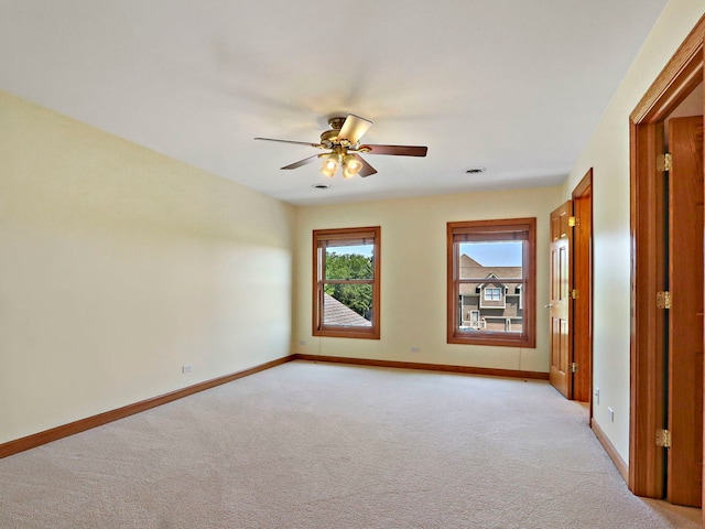 9804 Palmer Dr, Lakewood, IL 60014 - empty room with light carpet and a ceiling fan