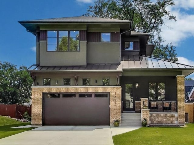 1437 Ashland Ave, River Forest, IL 60305 - view of front of house featuring a standing seam roof, covered porch, an attached garage, concrete driveway, and brick siding