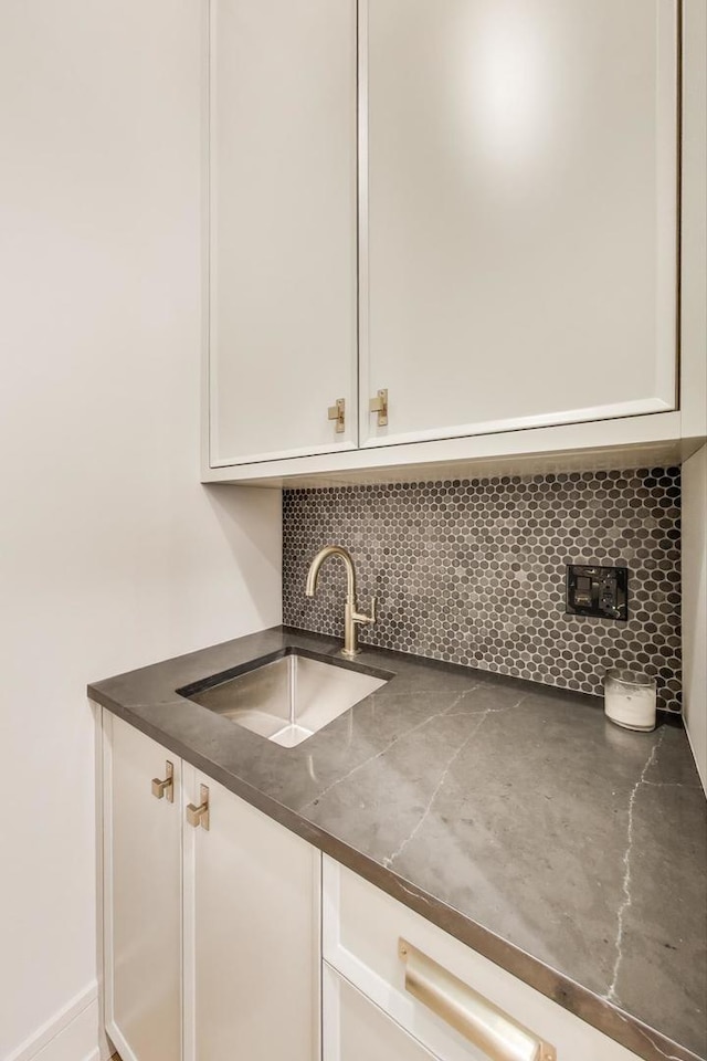 1437 Ashland Ave, River Forest, IL 60305 - kitchen featuring dark countertops, white cabinets, and backsplash