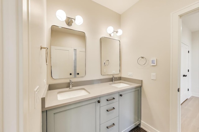 1437 Ashland Ave, River Forest, IL 60305 - bathroom featuring baseboards and double vanity