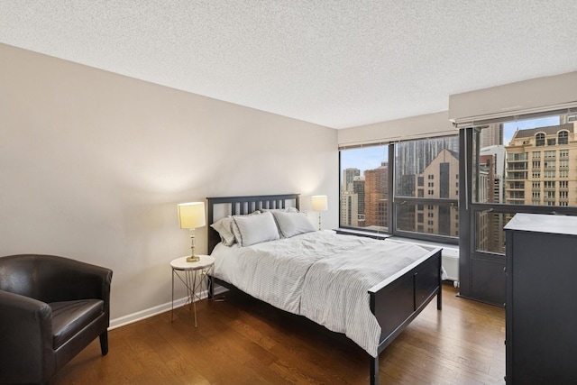 30 E Huron St Unit 2108, Chicago, IL 60611 - bedroom featuring wood finished floors, a textured ceiling, and a view of city