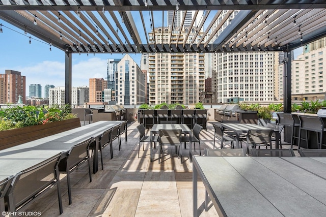 30 E Huron St Unit 2108, Chicago, IL 60611 - view of patio / terrace featuring a city view, a pergola, and outdoor dining area