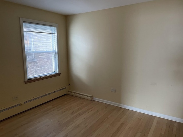 2020 W 53rd Pl, Chicago, IL 60609 - spare room with light wood finished floors and baseboard heating