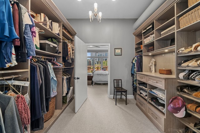 849 W Monroe St Unit Ph5, Chicago, IL 60607 - spacious closet with a chandelier and light carpet