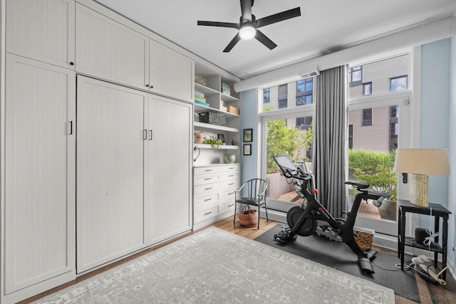 849 W Monroe St Unit Ph5, Chicago, IL 60607 - workout room featuring a ceiling fan and wood finished floors