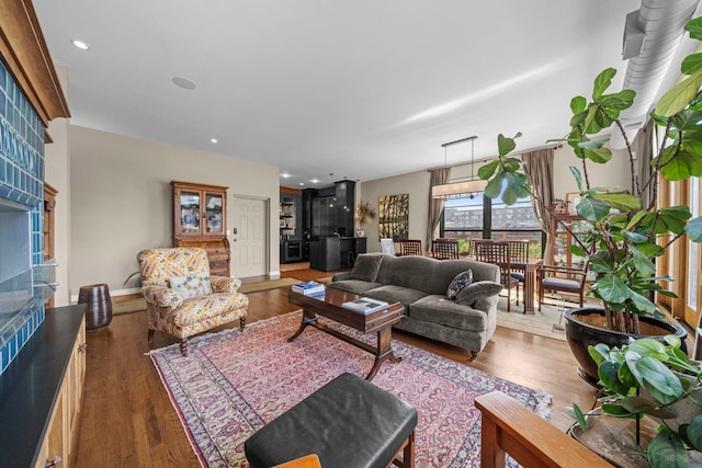 849 W Monroe St Unit Ph5, Chicago, IL 60607 - living area with wood finished floors, a fireplace, and recessed lighting