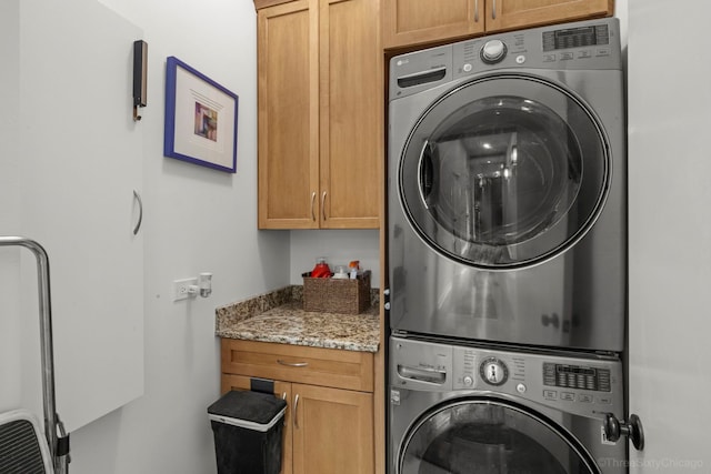 849 W Monroe St Unit Ph5, Chicago, IL 60607 - laundry area with stacked washing machine and dryer and cabinet space