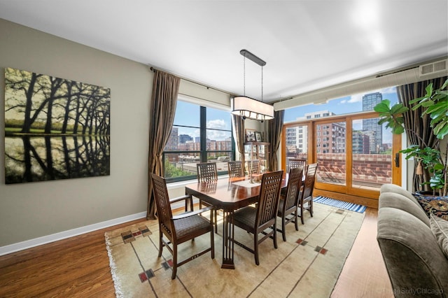 849 W Monroe St Unit Ph5, Chicago, IL 60607 - dining space featuring a city view and light wood finished floors
