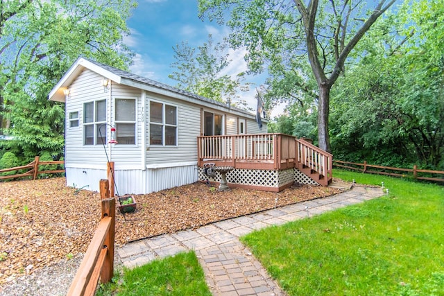 59 Fossil Ridge Ct, Wilmington, IL 60481 - view of front facade featuring a wooden deck