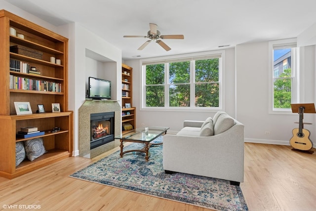 1931 N Campbell Ave Unit 2S, Chicago, IL 60647 - living room with wood finished floors, a fireplace with flush hearth, a ceiling fan, and built in features