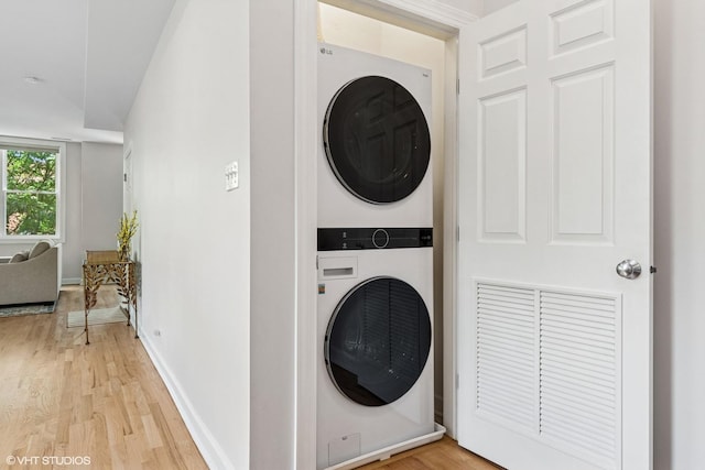 1931 N Campbell Ave Unit 2S, Chicago, IL 60647 - laundry room featuring stacked washer and clothes dryer and light wood-type flooring