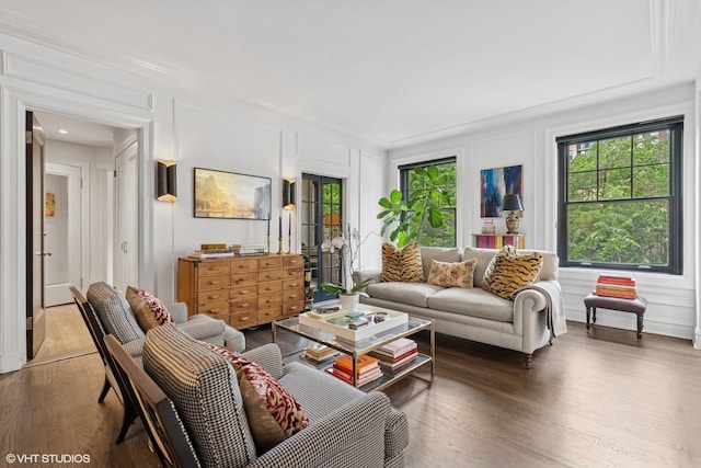 1255 N State Pkwy Unit 3D, Chicago, IL 60610 - living area featuring a decorative wall, crown molding, and wood finished floors