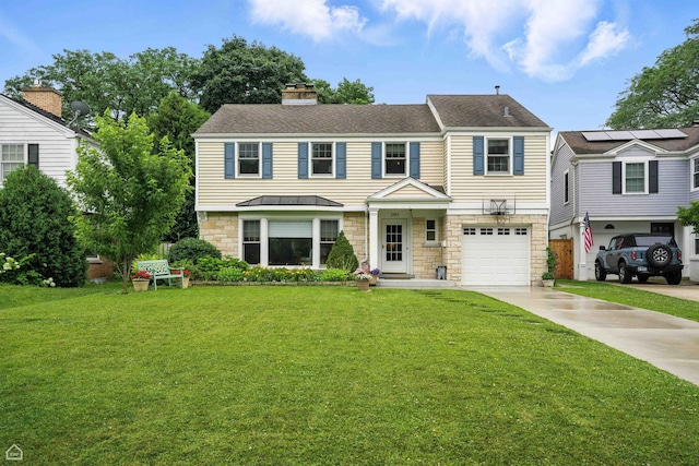 2907 Orchard Ave, Wilmette, IL 60091 - view of front of home featuring driveway, a front lawn, a standing seam roof, a garage, and stone siding