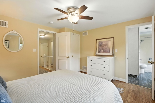 2907 Orchard Ave, Wilmette, IL 60091 - bedroom with wood finished floors, ensuite bath, and a ceiling fan