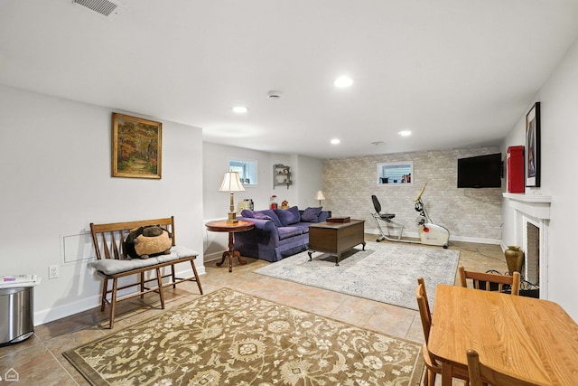 2907 Orchard Ave, Wilmette, IL 60091 - tiled living area featuring a fireplace, recessed lighting, and brick wall