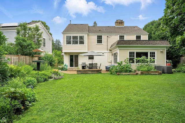 2907 Orchard Ave, Wilmette, IL 60091 - back of house with a chimney, a patio area, and roof with shingles