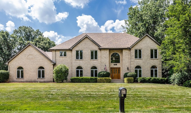 771 E Hickory Ave, Addison, IL 60101 - view of front of property featuring a front yard, brick siding, and a shingled roof