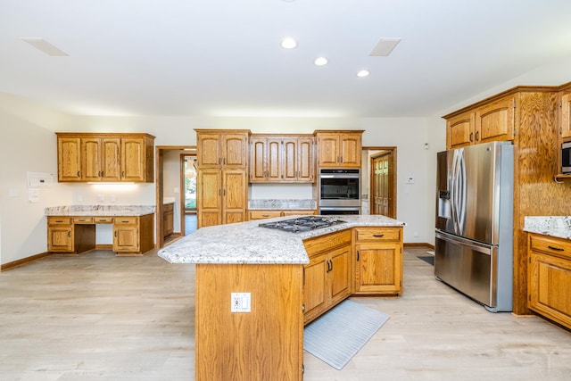 771 E Hickory Ave, Addison, IL 60101 - kitchen with appliances with stainless steel finishes, a kitchen island, light wood-style floors, brown cabinets, and recessed lighting