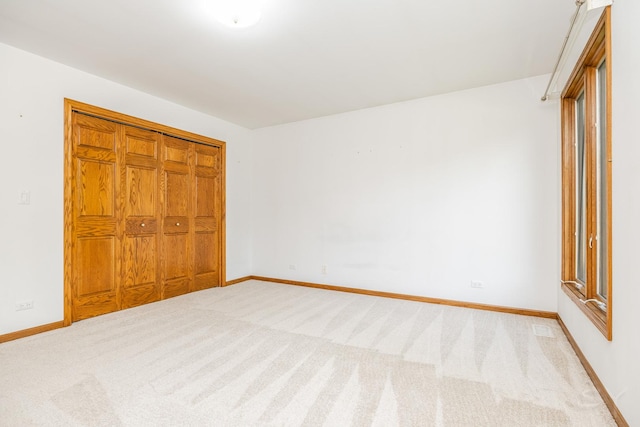 771 E Hickory Ave, Addison, IL 60101 - unfurnished bedroom with light colored carpet and a closet