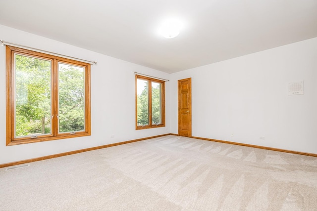 771 E Hickory Ave, Addison, IL 60101 - unfurnished room featuring healthy amount of natural light and light colored carpet