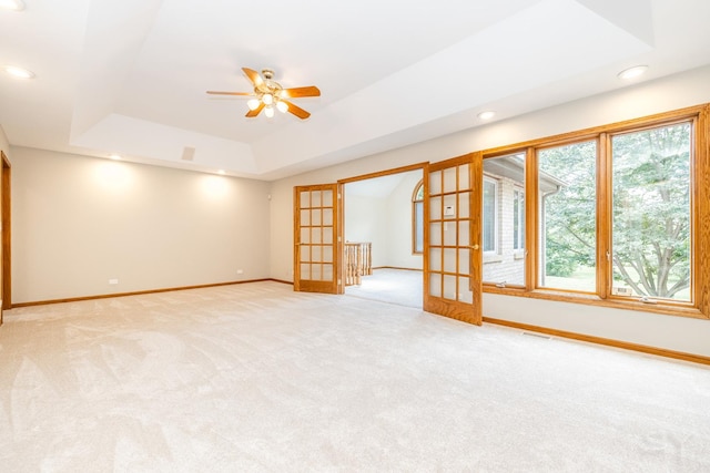 771 E Hickory Ave, Addison, IL 60101 - empty room featuring light colored carpet, ceiling fan, a raised ceiling, recessed lighting, and french doors