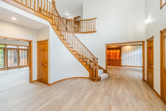771 E Hickory Ave, Addison, IL 60101 - staircase with a high ceiling, wood finished floors, and recessed lighting