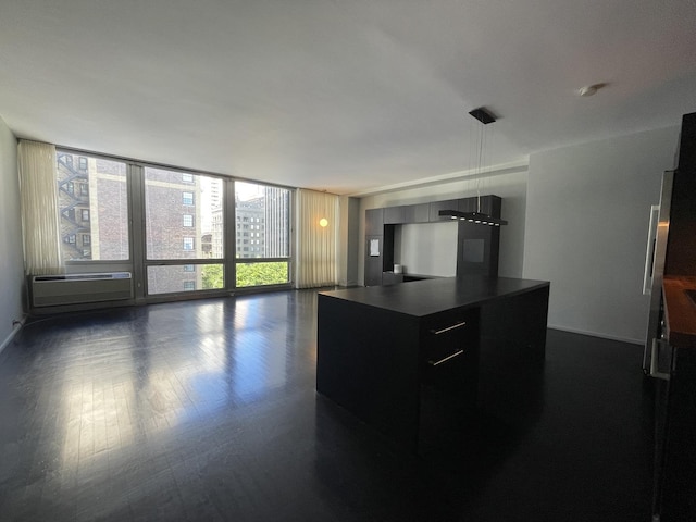 880 N Lake Shore Dr Unit 6F, Chicago, IL 60611 - kitchen featuring an AC wall unit, dark countertops, expansive windows, open floor plan, and dark cabinets