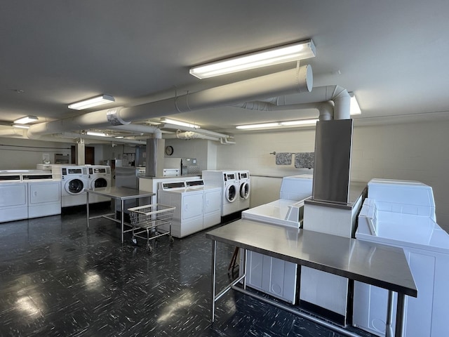 880 N Lake Shore Dr Unit 6F, Chicago, IL 60611 - communal laundry room with washing machine and clothes dryer and tile patterned floors