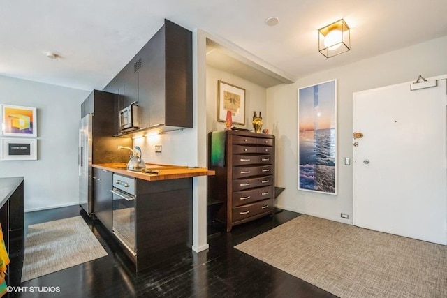 880 N Lake Shore Dr Unit 6F, Chicago, IL 60611 - kitchen with wood counters, stainless steel appliances, dark wood-style flooring, and modern cabinets