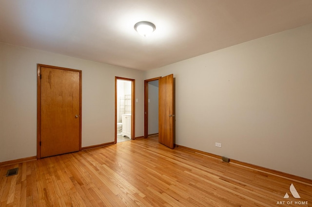 14940 Wilco Dr, Homer Glen, IL 60491 - unfurnished bedroom featuring light wood-style floors and ensuite bath