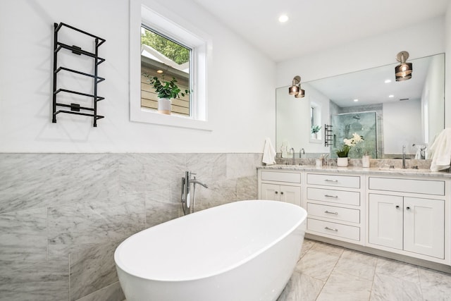 1726 W Huron St, Chicago, IL 60622 - full bathroom with tile walls, double vanity, a freestanding bath, a shower stall, and recessed lighting