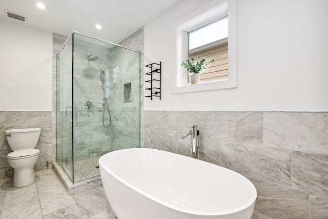 1726 W Huron St, Chicago, IL 60622 - full bath with tile walls, a soaking tub, a shower stall, a wainscoted wall, and recessed lighting