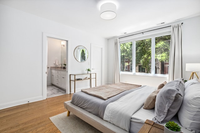 1726 W Huron St, Chicago, IL 60622 - bedroom featuring light wood-type flooring and ensuite bath