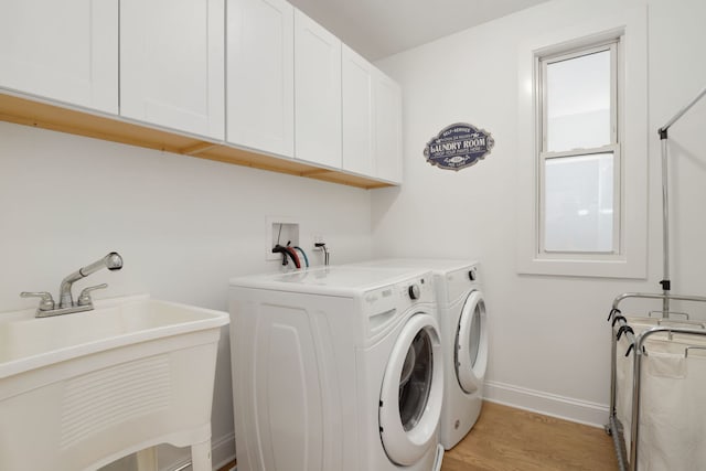 1726 W Huron St, Chicago, IL 60622 - laundry area with separate washer and dryer, cabinet space, and light wood-style flooring