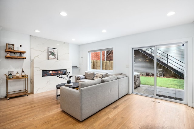 1726 W Huron St, Chicago, IL 60622 - living area with light wood-style flooring, a fireplace, and recessed lighting