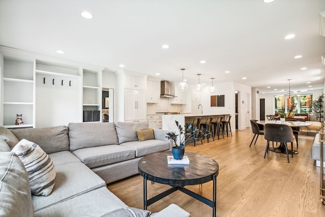 1726 W Huron St, Chicago, IL 60622 - living room featuring light wood-style flooring and recessed lighting