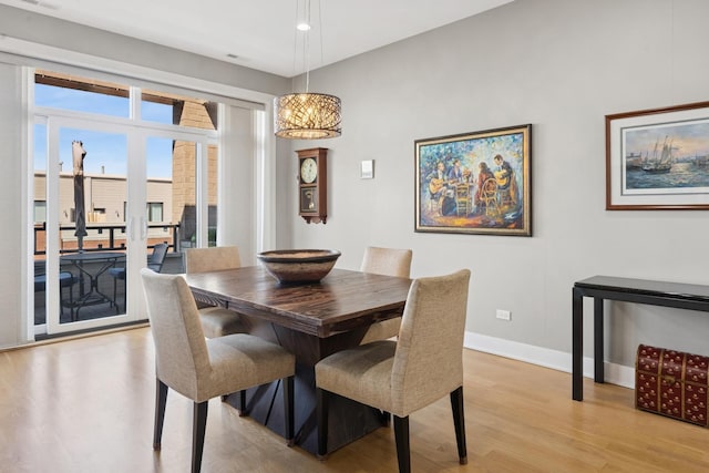 4115 N Lincoln Ave Unit 4N, Chicago, IL 60618 - dining area featuring light wood finished floors and a chandelier