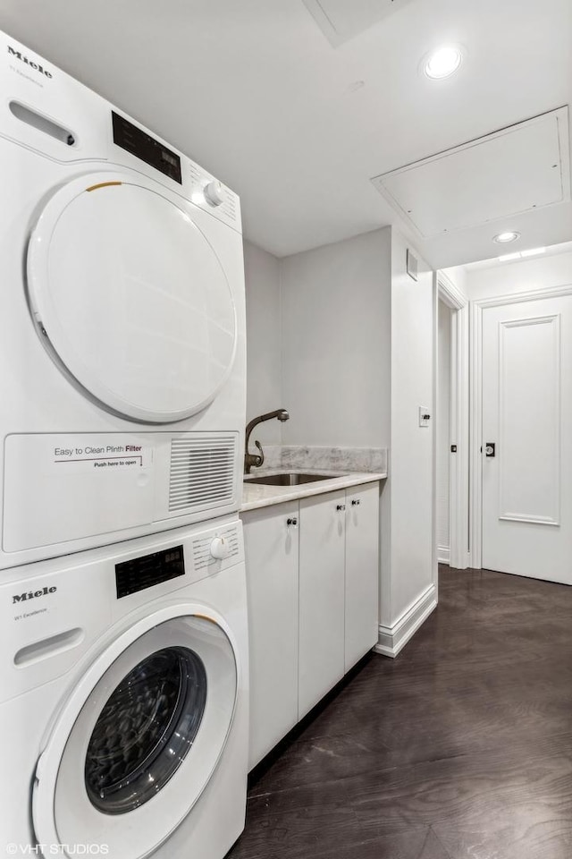 1040 N Lake Shore Dr Unit 26B, Chicago, IL 60611 - laundry area with attic access, stacked washer and clothes dryer, recessed lighting, and cabinet space