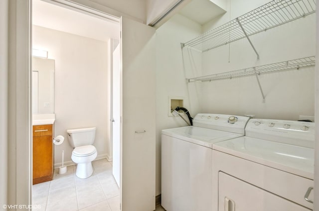1720 Oak Ave Unit 407, Evanston, IL 60201 - laundry area featuring separate washer and dryer and light tile patterned flooring