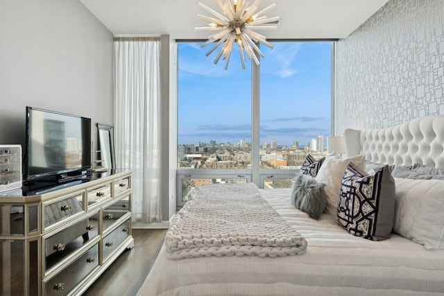 500 W Superior St Unit 1504, Chicago, IL 60654 - bedroom with a chandelier, floor to ceiling windows, wood finished floors, and a view of city