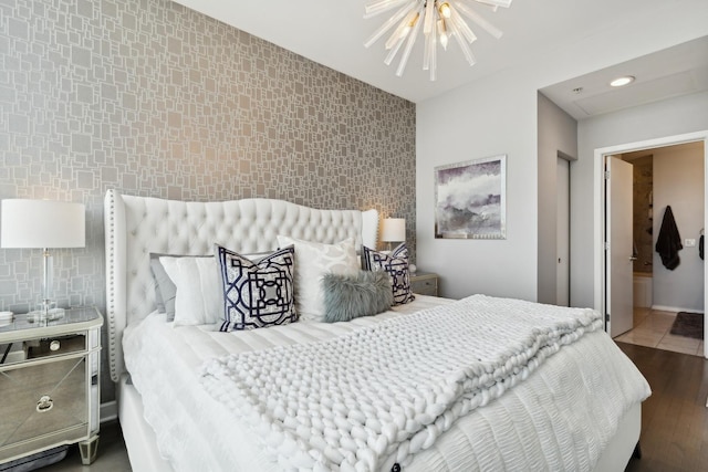 500 W Superior St Unit 1504, Chicago, IL 60654 - bedroom featuring an accent wall, recessed lighting, wood finished floors, a chandelier, and ceiling fan